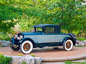 AUT 18 RK0810 01
1925 Lincoln Judkins Coupe Blue 3/4 Side View On Pavement By Trees