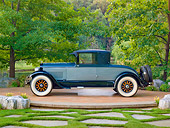 AUT 18 RK0811 01
1925 Lincoln Judkins Coupe Blue Profile View On Pavement By Trees