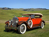 AUT 18 RK0815 01
1929 Packard 645 Dual Cowl Phaeton Orange With Brown Fenders 3/4 Front View On Grass