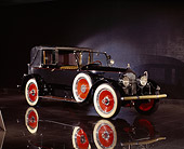 AUT 18 RK0028 09
1920 Packard Transformable Town Car Black 3/4 Front View On Mylar Floor Studio
