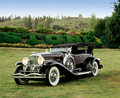 AUT 18 RK0067 01
1929 Duesenberg Phaeton Dual Cowl Black 3/4 Front View On Grass