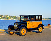 AUT 18 RK0081 05
1926 Studebaker Taxi Black And Yellow Checkered 3/4 Side View On Pavement