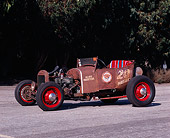 AUT 18 RK0290 02
1926 Ford Roadster Rusty Brown 3/4 Side View On Pavement Trees