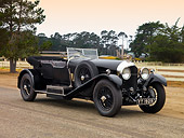 AUT 18 RK0297 01
1927 Bentley 6.5 Liter Vanden Plas Convertible Black Front 3/4 View On Pavement By Fence Trees