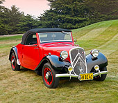 AUT 19 BK0004 01
1938 Citroen Traction Roadster Red And Black 3/4 Front View On Grass By Trees