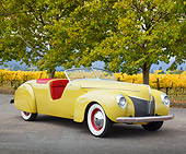 AUT 19 BK0005 01
1939 Coachcraft Mercury Roadster Cigarette Cream 3/4 Front View On Pavement By Vineyard