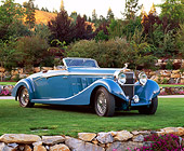 AUT 19 RK0441 02
1934 Hispano Suiza J12 Cabriolet Blue 3/4 Front View On Grass By Trees