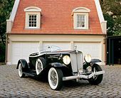 AUT 19 RK0510 01
1933 Auburn V-12 Boat-tail Speedster Black 3/4 Front View On Driveway By Garage