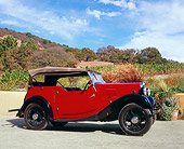 AUT 19 RK0595 02
1937 Morris Eight Touring Convertible Burgundy And Black Profile On Pavement By Hills And Trees