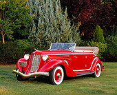 AUT 19 RK0615 02
1935 Auburn 851 Supercharged Convertible Red And Cream Front 3/4 View On Grass By Trees