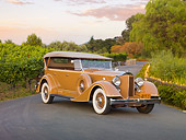 AUT 19 RK0739 01
1934 Packard Touring Super Eight Nutmeg 3/4 Front View On Pavement By Vineyard