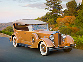 AUT 19 RK0745 01
1934 Packard Touring Super Eight Nutmeg 3/4 Front View On Pavement By Trees