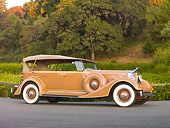 AUT 19 RK0746 01
1934 Packard Touring Super Eight Nutmeg Profile View On Pavement By Trees