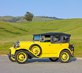 AUT 19 RK0773 01
1930 Ford Model A Phaeton STD Yellow 3/4 Side View On Pavement By Grassy Hills