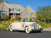 AUT 19 RK0835 01
1935 Packard Convertible 1201 Cream 3/4 Front View On Pavement By House