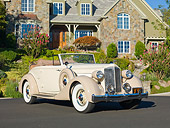AUT 19 RK0836 01
1935 Packard Convertible 1201 Cream 3/4 Front View On Pavement By House