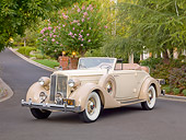 AUT 19 RK0843 01
1935 Packard Convertible 1201 Cream 3/4 Front View On Pavement By Trees And House