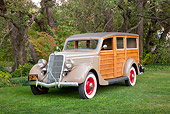 AUT 19 RK0848 01
1935 Ford Woodie Beige 3/4 Front View On Grass By Trees