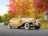 AUT 19 RK0874 01
1932 Chrysler Convertible Coupe Beige 3/4 Front View On Pavement By House And Autumn Trees