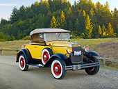 AUT 19 RK0898 01
1930 Ford Model A Yellow 3/4 Front View On Gravel By Grass Field And Trees