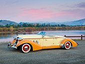AUT 19 RK0905 01
1936 Auburn Speedster Tan And Brown 3/4 Side View On Gravel By Lake At Dusk