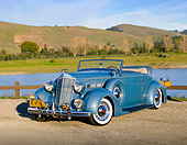 AUT 19 RK0910 01
1936 Packard 120 Convertible Blue 3/4 Front View On Gravel By Hills And Lake