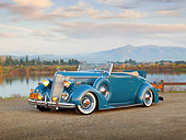 AUT 19 RK0911 01
1936 Packard 120 Convertible Blue 3/4 Front View On Gravel By Hills And Lake