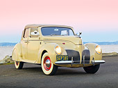 AUT 19 RK0925 01
1939 Lincoln Zephyr Convertible Cream 3/4 Front View On Pavement By Water At Dusk