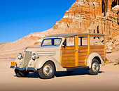 AUT 19 RK0930 01
1936 Ford Woodie Station Wagon Brown 3/4 Side View On Sand By Red Rock