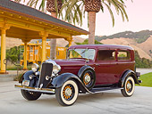 AUT 19 RK0941 01
1933 Dodge DP Maroon And Black 3/4 Front View On Concrete By Train Station