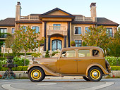 AUT 19 RK0957 01
1935 Chevrolet Sedan Hollywood Tan Profile View On Pavement By Mansion