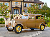 AUT 19 RK0959 01
1935 Chevrolet Sedan Hollywood Tan Profile View On Pavement By Mansion