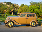 AUT 19 RK0964 01
1935 Chevrolet Sedan Hollywood Tan Profile View On Pavement By Lawn