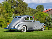 AUT 19 RK1005 01
1934 Pierce Arrow Model 840A Silver Arrow Coupe Silver And Gunmetal 3/4 Rear View On Grass By Trees