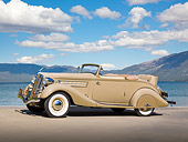 AUT 19 RK1020 01
1935 Hudson Convertible Pepper Tan Profile View On Pavement By Water