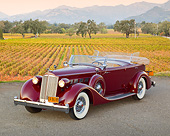 AUT 19 RK1028 01
1936 Packard Super 8 Dual Cowl Phaeton Maroon 3/4 Front View On Pavement By Vineyard