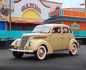 AUT 19 RK1056 01
1937 Ford Deluxe Slantback 4 Door Adobe Tan 3/4 Front View On Pavement By Carnival Games