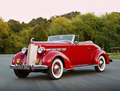 AUT 19 RK1057 01
1937 Packard 120 Convertible Coupe Red 3/4 Front View On Pavement By Trees