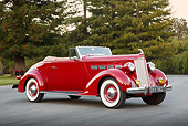 AUT 19 RK1059 01
1937 Packard 120 Convertible Coupe Red 3/4 Side View On Pavement By Trees