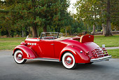 AUT 19 RK1060 01
1937 Packard 120 Convertible Coupe Red 3/4 Rear View On Pavement By Trees