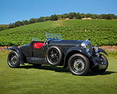 AUT 19 RK1061 01
1930 Bentley 4 Black 3/4 Side View On Grass By Vineyard