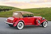 AUT 19 RK1065 01
1933 Chrysler CL Red 3/4 Rear View On Pavement By Grassy Hills At Dusk