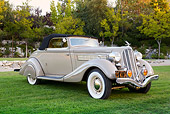 AUT 19 RK1066 01
1935 Hudson Convertible Pepper Tan 3/4 Front View On Grass By Trees