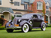 AUT 19 RK1071 01
1936 Studebaker President Maroon 3/4 Front View On Grass By House