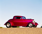 AUT 19 RK0031 01
1933 Ford Plumb Crazy Street Rod Low 3/4 Front View On Pavement Blue Sky