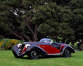 AUT 19 RK0099 01
1939 Alfa Romeo 2500 Super Sport 6C Red And Black 3/4 Front View On Grass