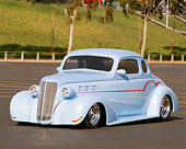 AUT 19 RK0127 01
1937 Chevrolet Coupe Light Blue Hot Rod 3/4 Front View In Parking Lot