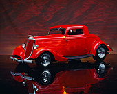 AUT 19 RK0175 04
1934 Ford Coupe Red With Flames 3/4 Side View On Mylar Floor Studio