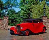 AUT 19 RK0179 16
1932 Ford Custom Roadster Red 3/4 Front View On Pavment By Trees