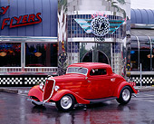 AUT 19 RK0222 12
1934 Ford Coupe Red 3/4 Front View On Pavement In Front Of Diner